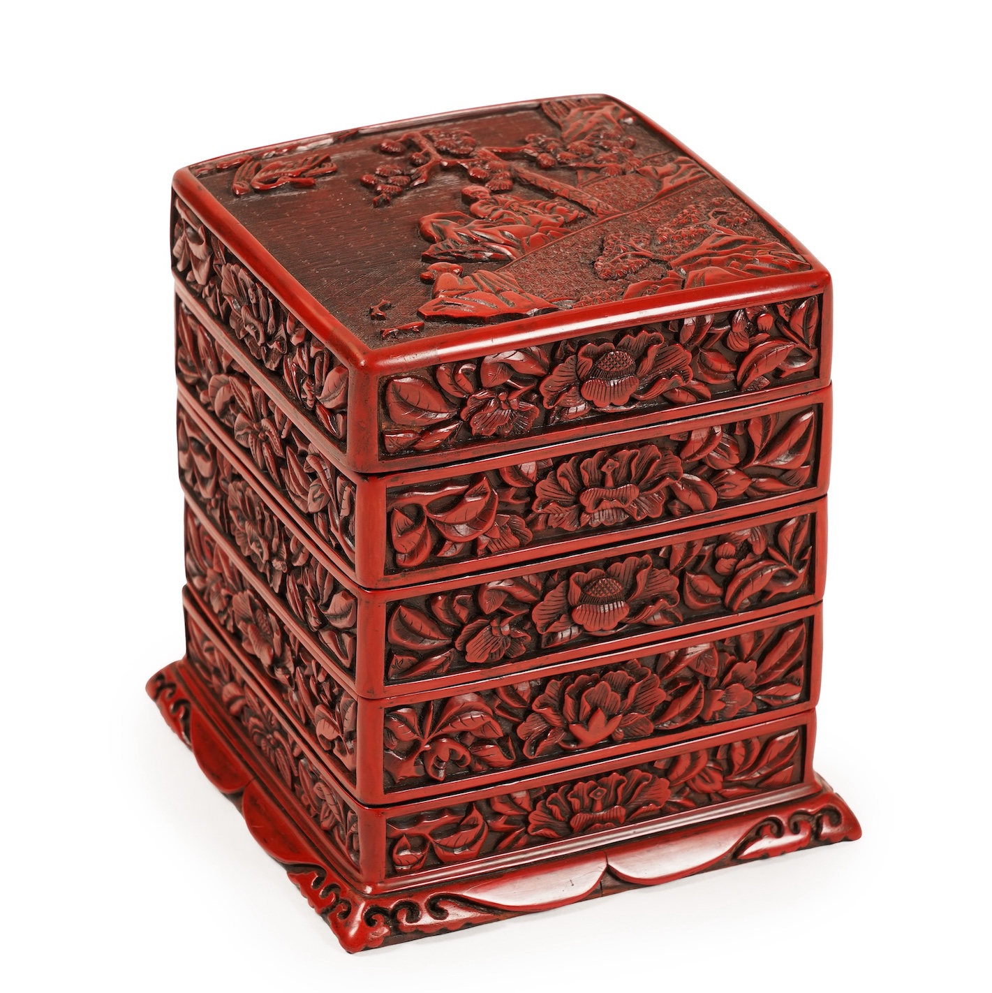 A Chinese Ming cinnabar lacquer four tier box, 15th century